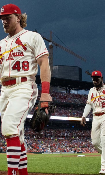 Cardinals wait out hours-long rain delay, top Cubs 7-4